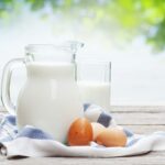 Fresh organic milk in a glass pitcher ready for daily family consumption