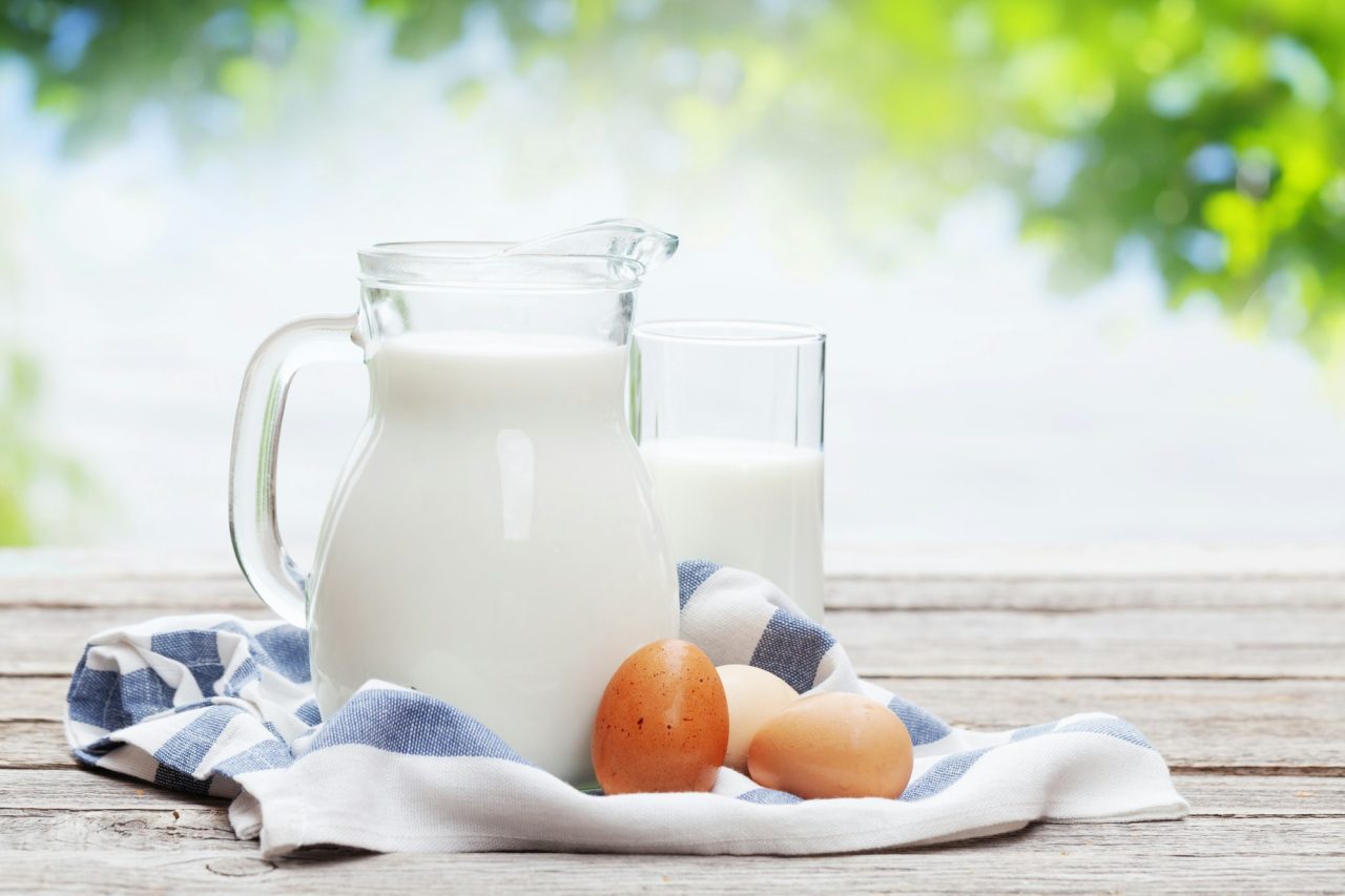 Fresh organic milk in a glass pitcher ready for daily family consumption